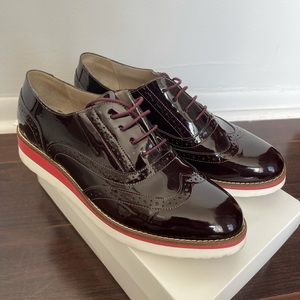 Women’s Boden patent leather Oxford shoes.